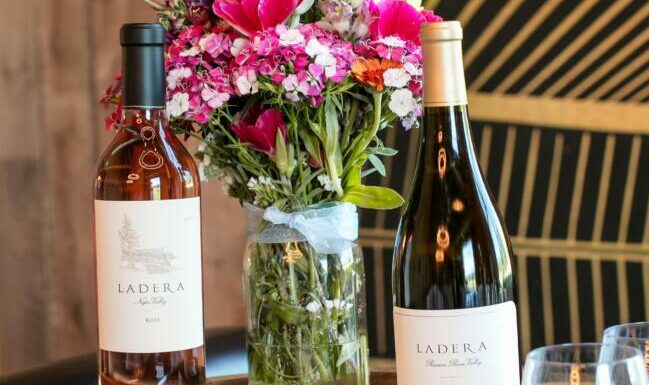 Bottles of Ladera wines and a vase of flowers